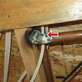 Electrical cables touching copper supply line.jpg